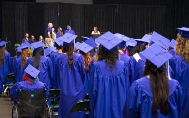 TVAH graduates standing for Head of School speech.