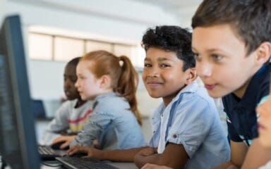 Young kids using computers