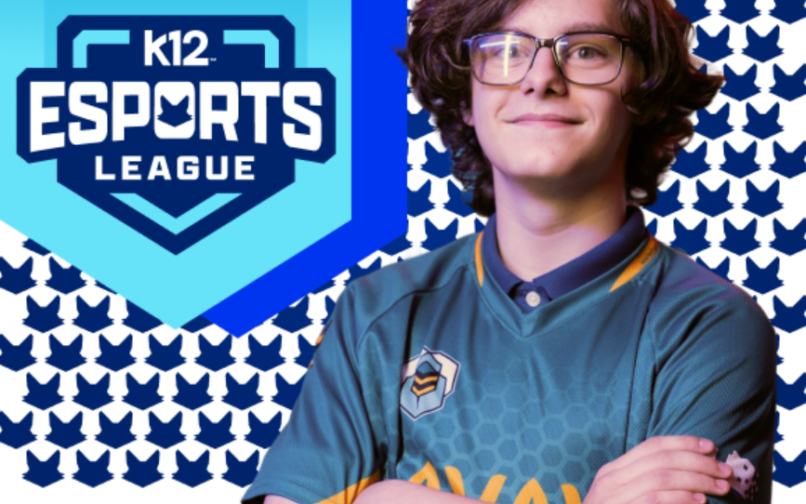 A person wearing a teal esports jersey stands with arms crossed in front of a patterned background featuring repeating blue fox-shaped icons. To the left, a large blue shield-shaped logo reads “K12 Esports League” with a stylized fox emblem above the text.